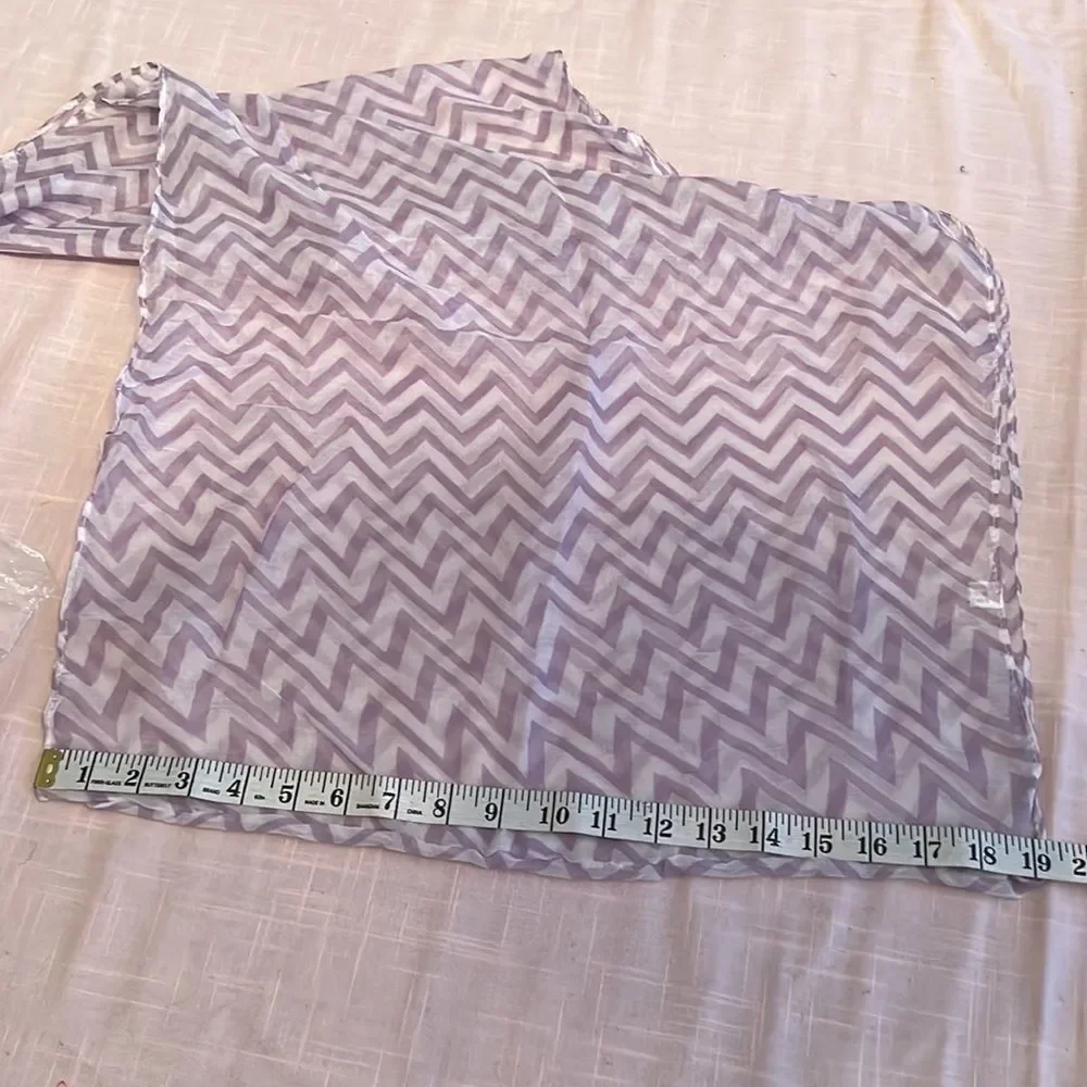 NWOT lavender and white infinity scarf. Adds flair to any outfit
